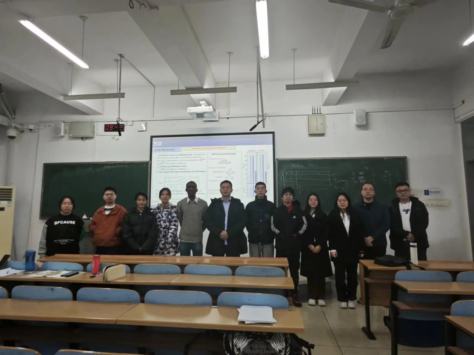 Laurent Kouadio with his class in front of the board