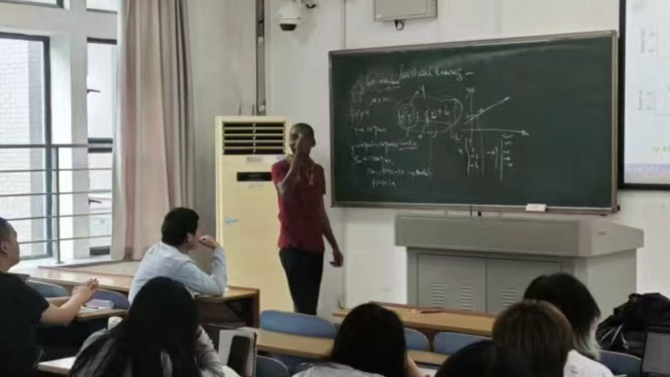 Laurent Kouadio teaching statistical learning at the chalkboard, CSU